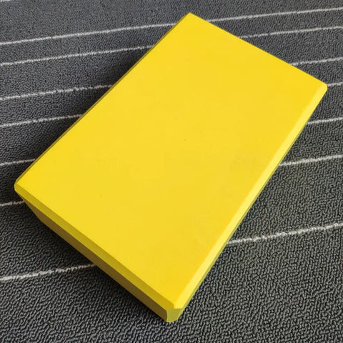 Yellow yoga block
